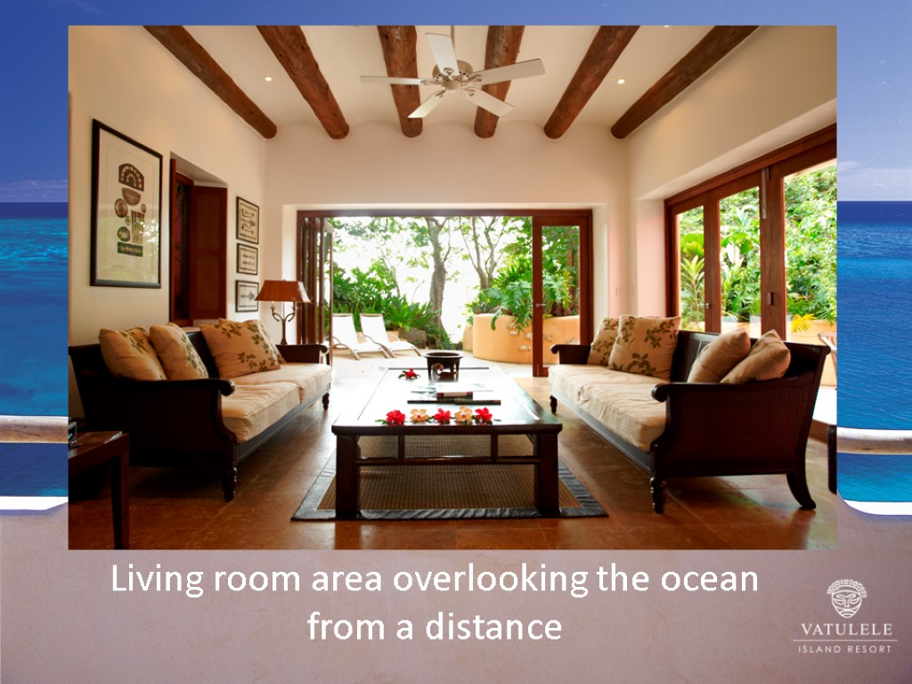 One of 2 room categories with bathtubs Living room area overlooking the ocean from